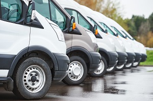 commercial vans parked in a line